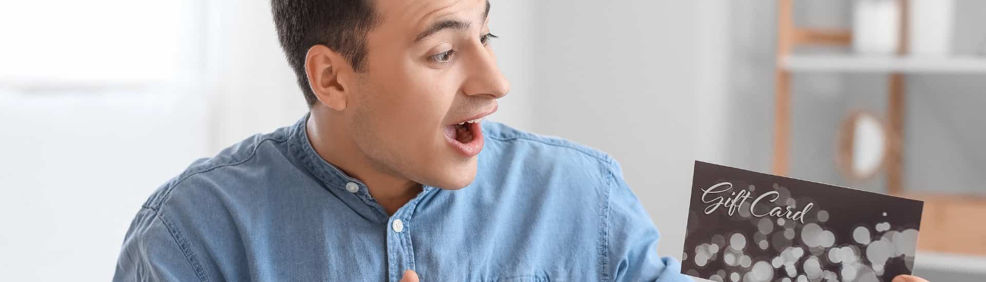 man holding gift certificates